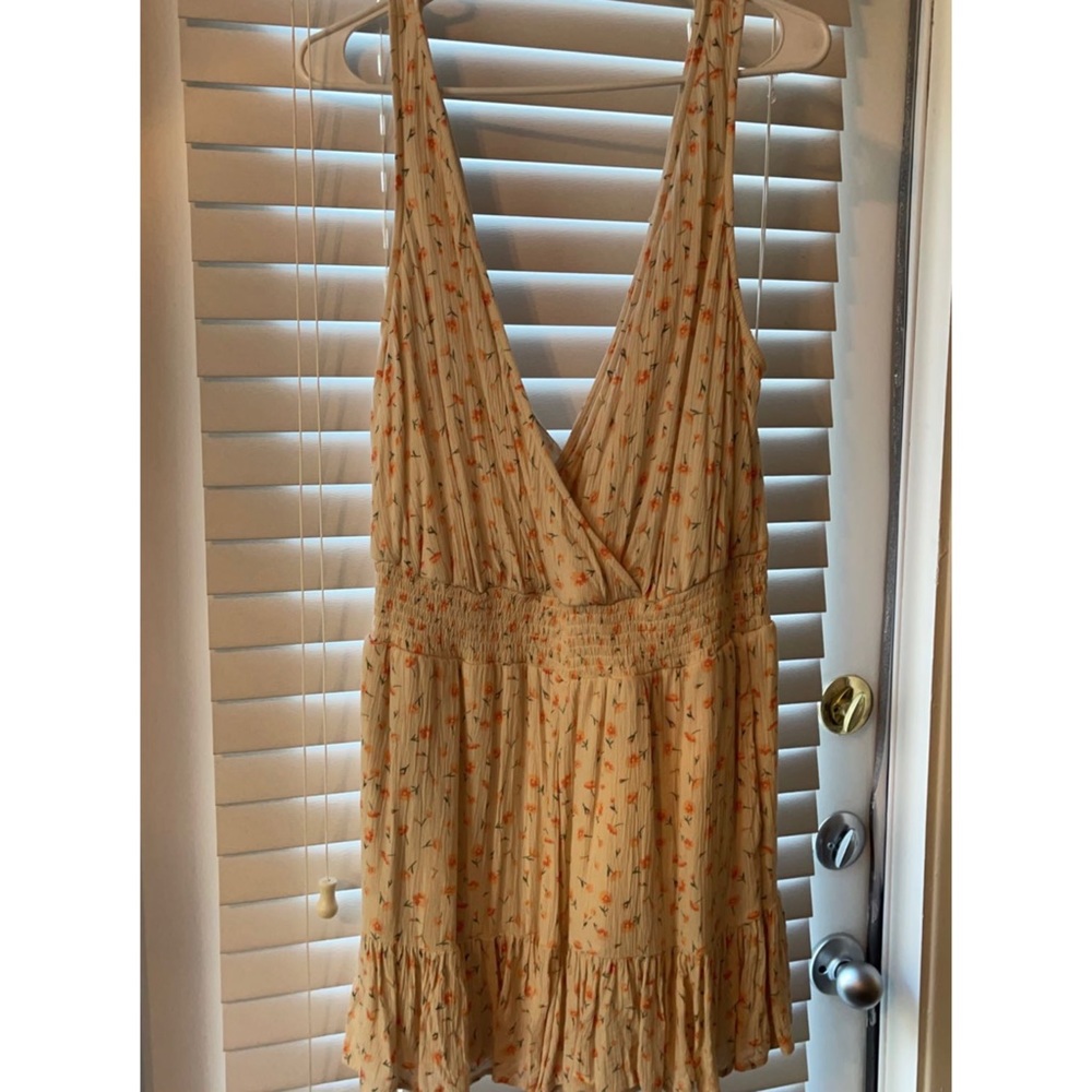 Cream romper with pink flowers